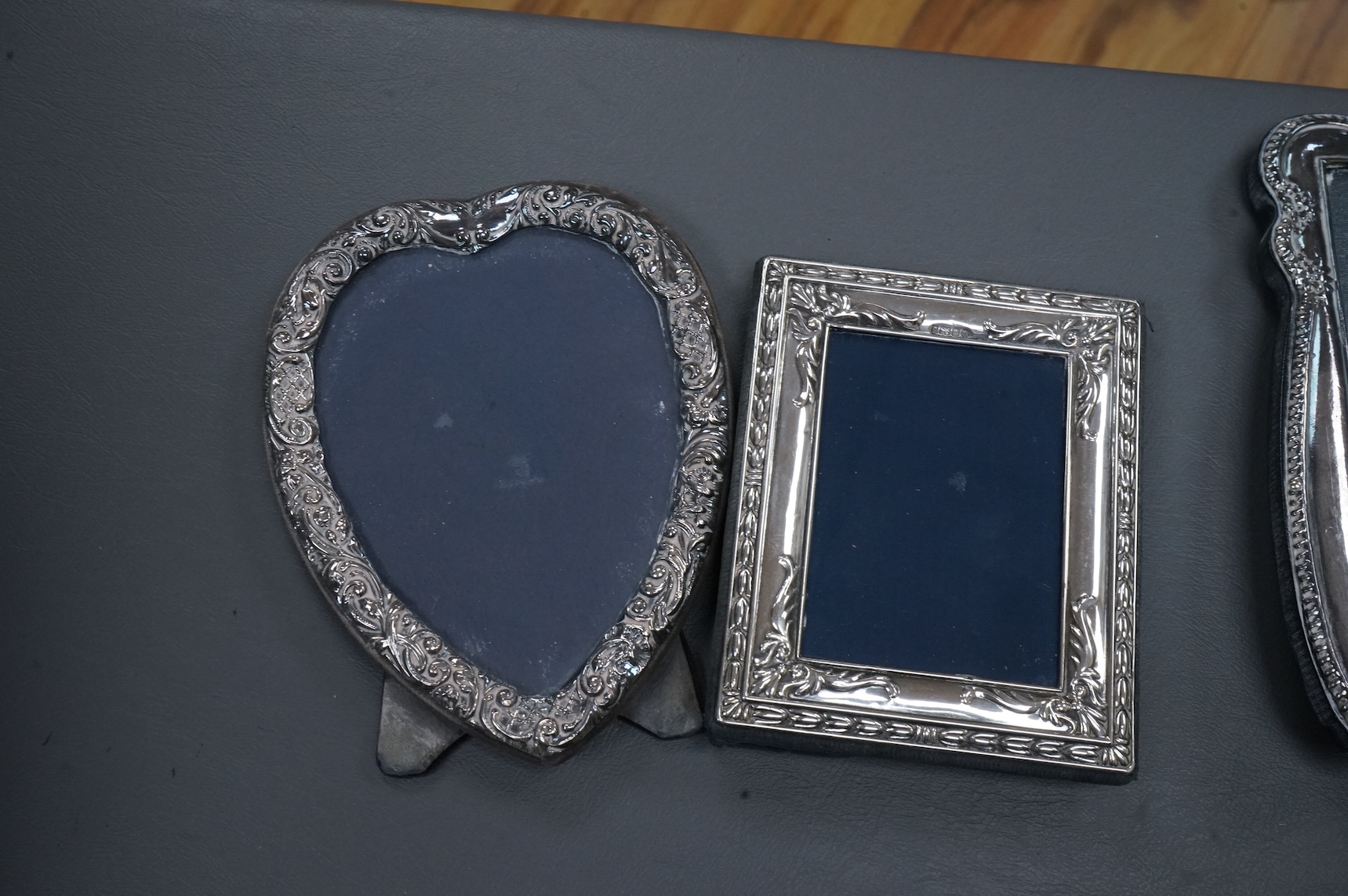 Eight assorted modern silver or sterling mounted photograph frames, including Britannia standard with heart shaped aperture, by CSR Ltd, London, 1981, 12.5cm.